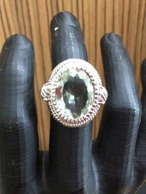 925 stamped sterling silver ring with large light green stone. Size 7.5